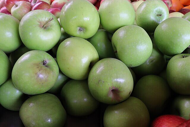Conventionally grown apples on display in a European supermarket amid concerns over pesticide residues.