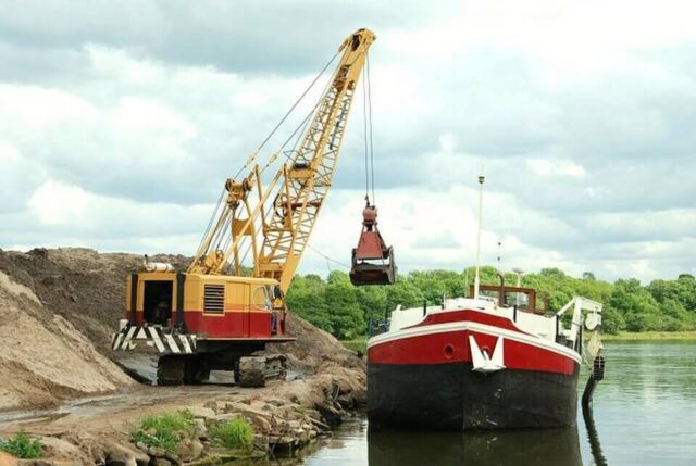 Sand dredging vessel extracting sediment on Lough Neagh in Northern Ireland