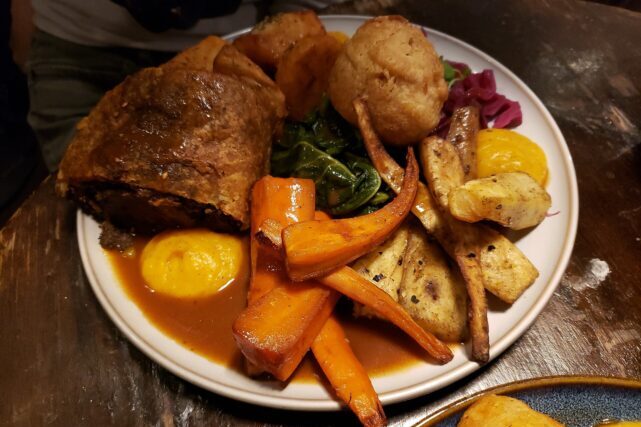 Traditional Sunday roast meal served with vegetables, representing UK food culture and farming supply chains.