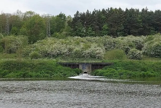 Sewage outfall discharging wastewater into an English river